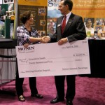 Monin CEO Bill Lombardo presenting rather large check Monin CEO Bill Lombardo presenting rather large check