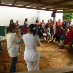 Dra. Lupita and nurse Monica counseling women before screening services