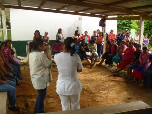 Dra. Lupita and nurse Monica counseling women before screening services