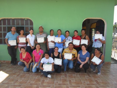 Newly trained Trainers proudly display their certificates